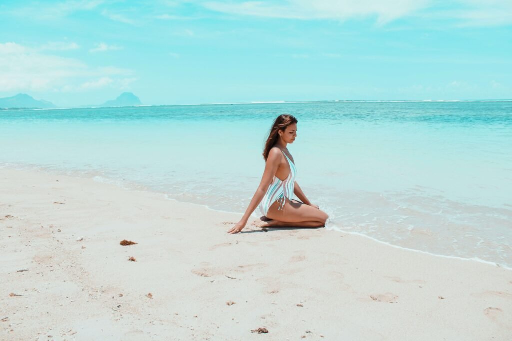 A woman sitting on the beach in Mauritius