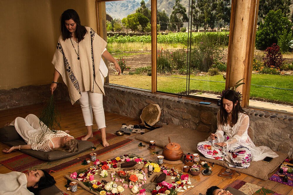 A woman conducting a Shamanic ritual with a group at one of the Mauritius retreats.