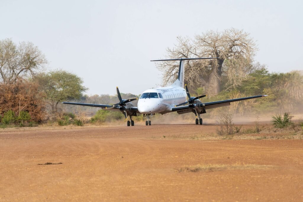 A private jet landing in a bush airstrip is what you can expect on a safari from Zanzibar to Tanzania.
