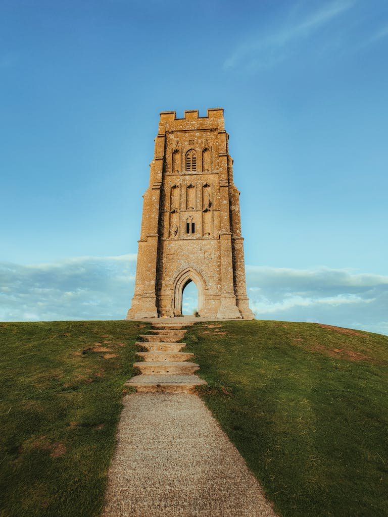 Breathtaking view of Glastonbury Tor against a clear blue sky in England.